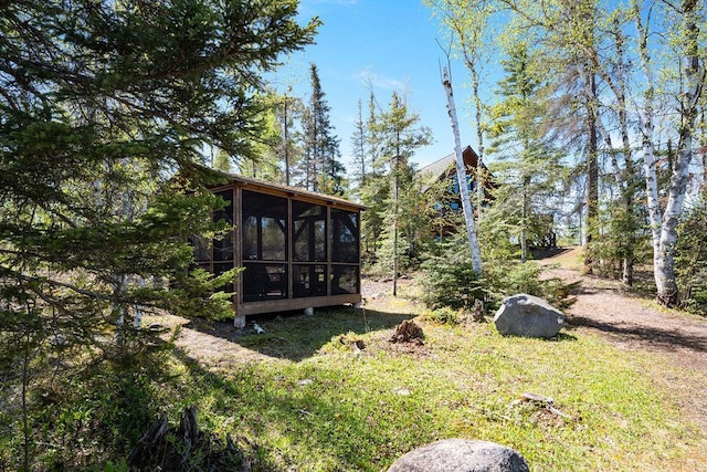 view of yard featuring a sunroom