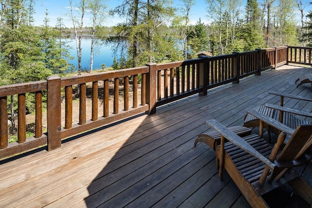 wooden deck featuring a water view