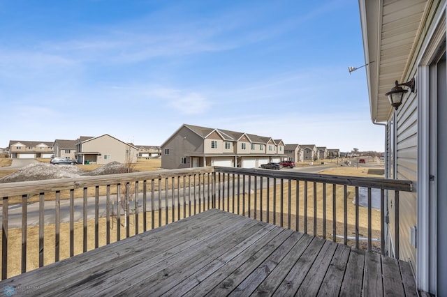 wooden terrace featuring a residential view