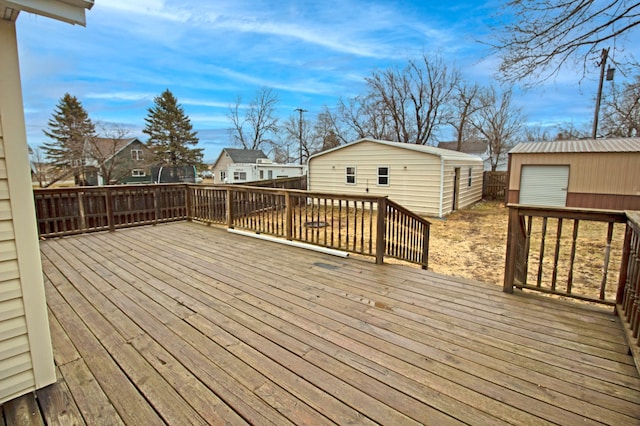 deck with an outbuilding and a residential view