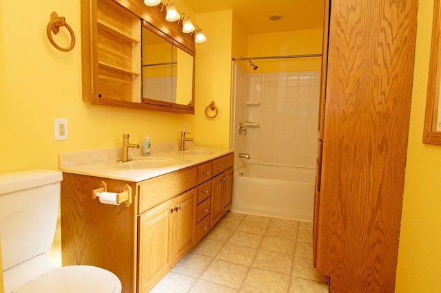 full bath with tile patterned floors, toilet, and a sink