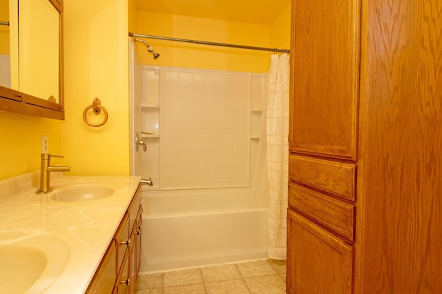 bathroom with double vanity, shower / bath combination with curtain, and a sink