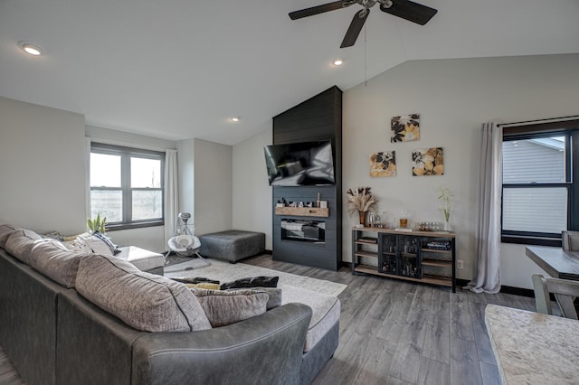 living room featuring recessed lighting, a ceiling fan, lofted ceiling, and wood finished floors