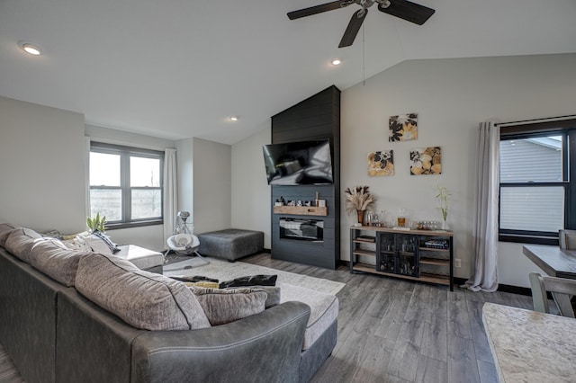 living room with ceiling fan, wood finished floors, vaulted ceiling, and recessed lighting