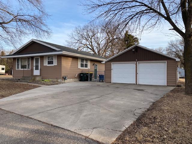 view of property exterior featuring an outbuilding and a garage