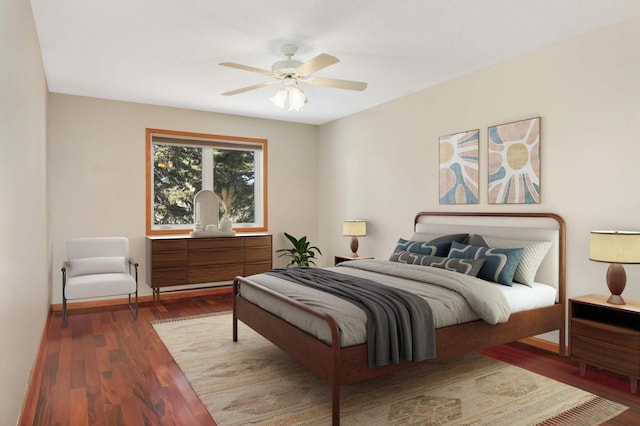 bedroom featuring baseboards, a ceiling fan, and wood finished floors