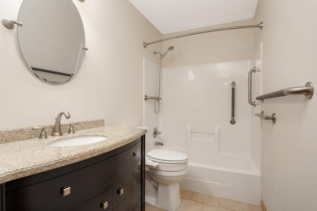 full bath with shower / bath combination, toilet, vanity, and tile patterned floors