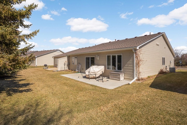 back of property featuring a patio and a yard