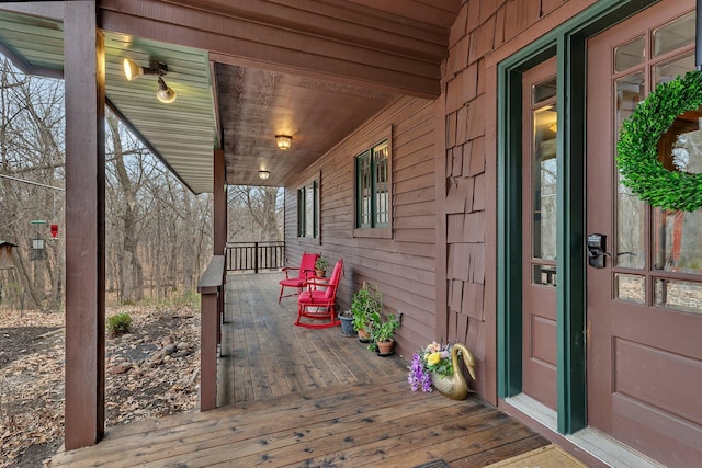 wooden terrace featuring a porch
