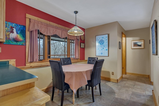 dining room featuring baseboards