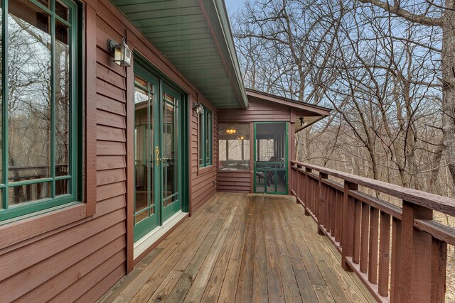deck with a sunroom