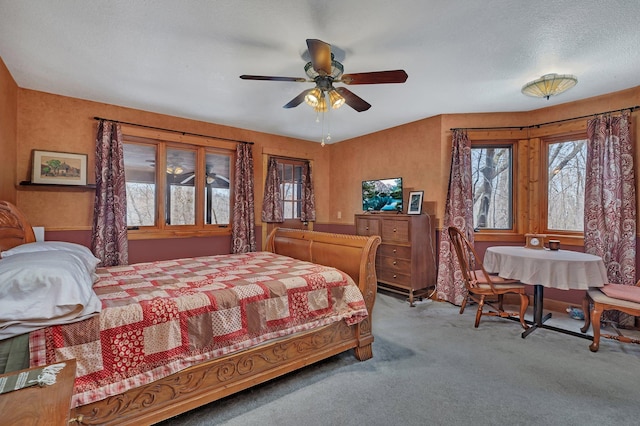 bedroom with ceiling fan and carpet flooring