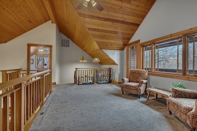living area featuring a ceiling fan, visible vents, wooden ceiling, and carpet