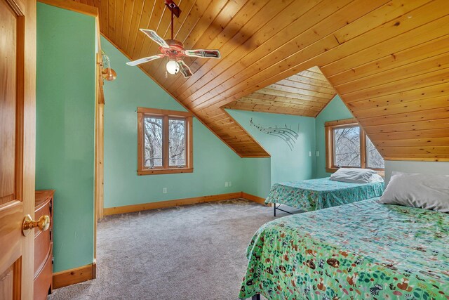bedroom featuring baseboards, lofted ceiling, wood ceiling, and carpet