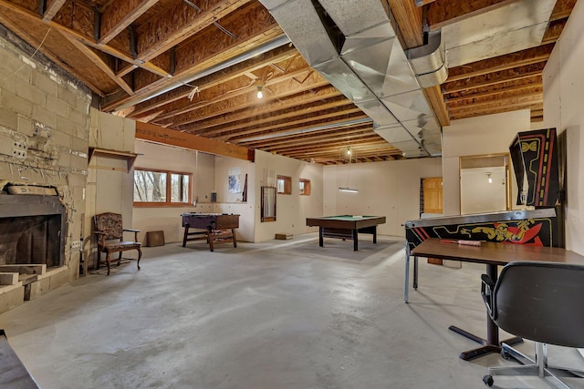 below grade area with billiards and a fireplace