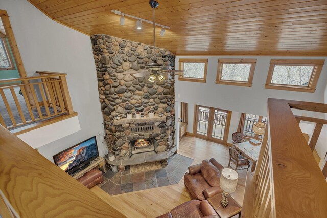 1356 119th St NW, Silver Creek Twp, MN 55362 - living room with track lighting, lofted ceiling, wood finished floors, a fireplace, and wood ceiling
