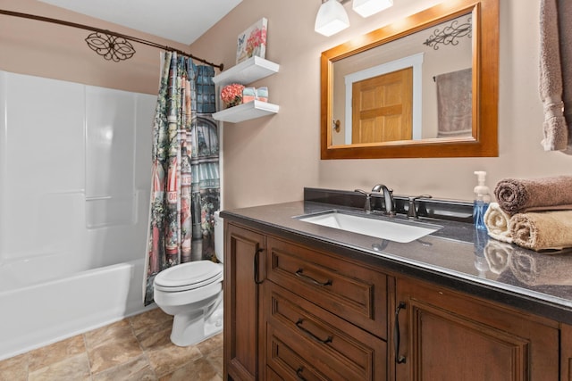 bathroom with shower / tub combo, toilet, and vanity