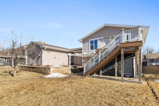 back of property with stairway and a wooden deck