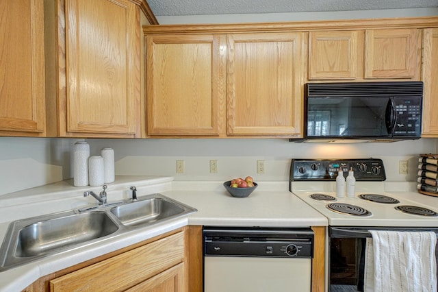 kitchen featuring range with electric cooktop, light brown cabinets, a sink, white dishwasher, and black microwave