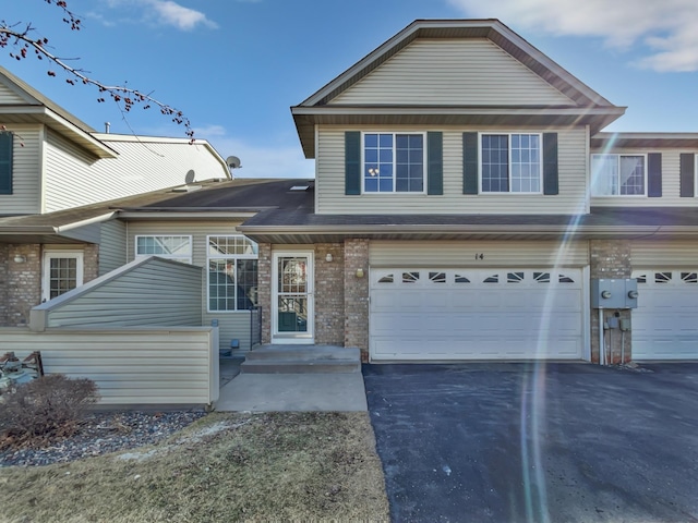 view of front of house with an attached garage and driveway