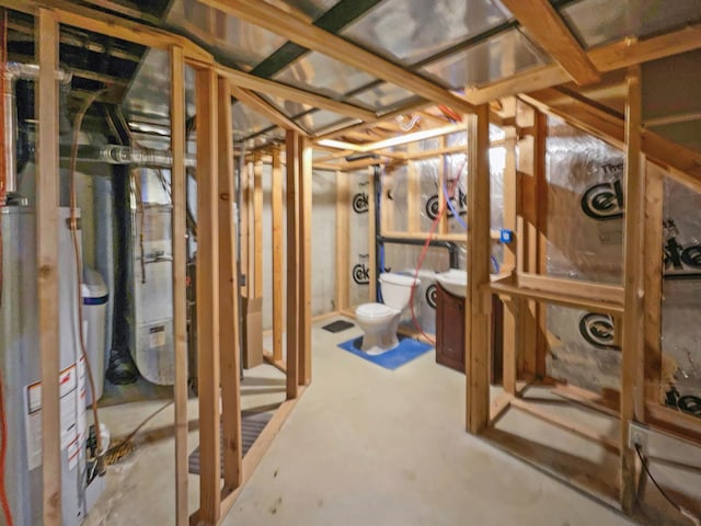 unfinished below grade area featuring gas water heater