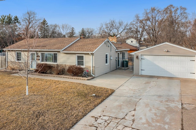 single story home featuring an outbuilding, fence, a shingled roof, a front lawn, and a garage