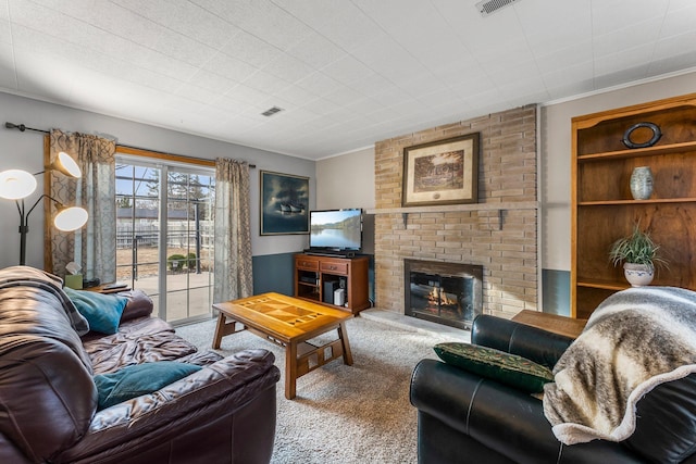 living room with visible vents, a fireplace, and carpet flooring