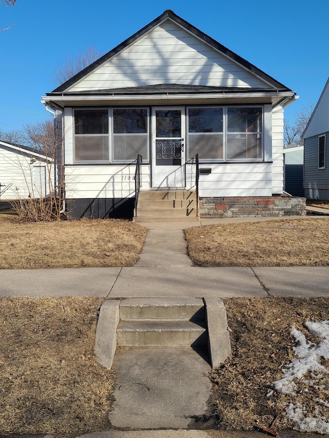 bungalow-style house featuring entry steps