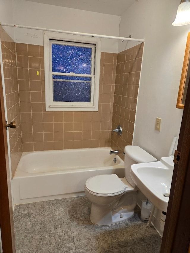 full bathroom with a sink, shower / bath combination, toilet, and tile patterned flooring