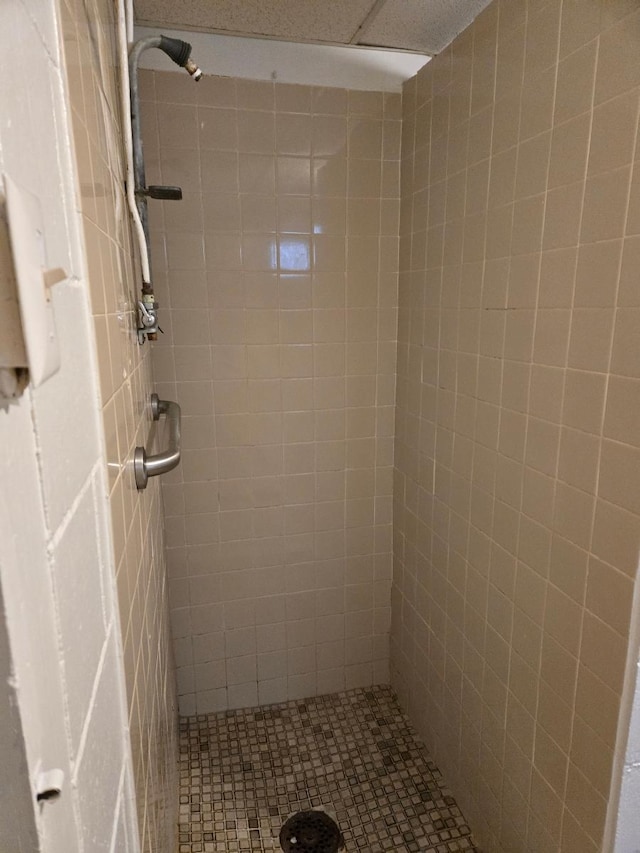 bathroom with a tile shower