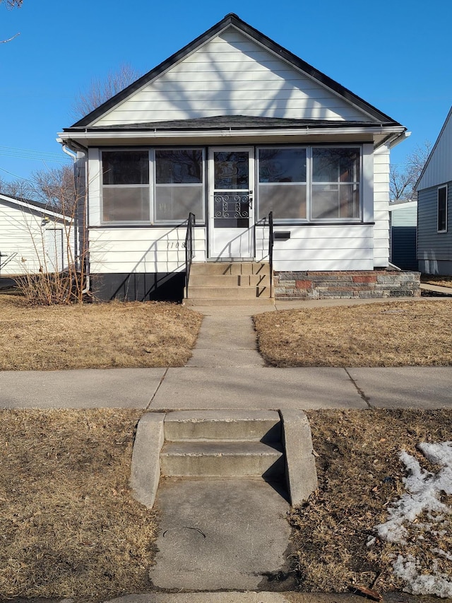 bungalow-style home with entry steps