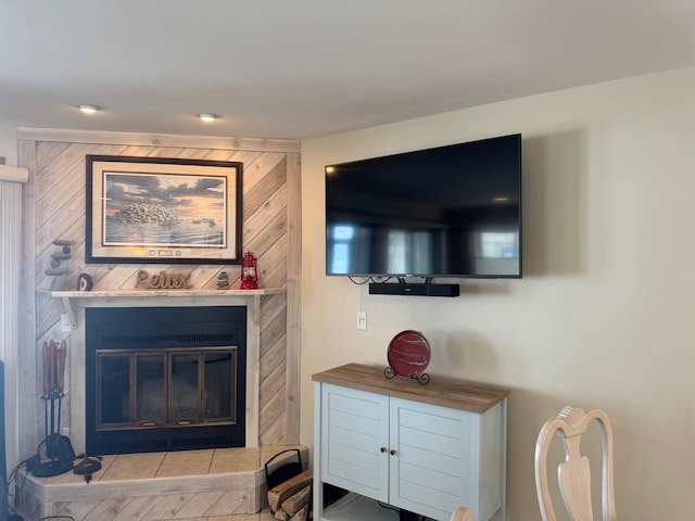 living area with a glass covered fireplace