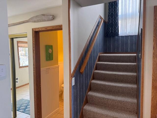 stairs featuring tile patterned flooring