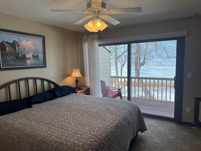 carpeted bedroom featuring multiple windows, a textured ceiling, ceiling fan, and access to exterior