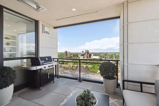 balcony featuring a grill and a view of city