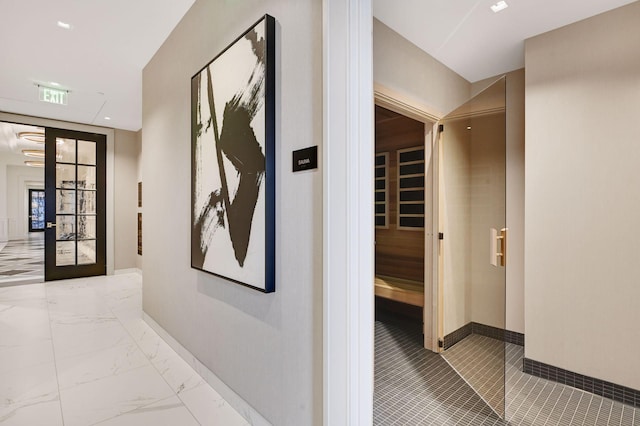 hallway with visible vents, marble finish floor, french doors, and baseboards