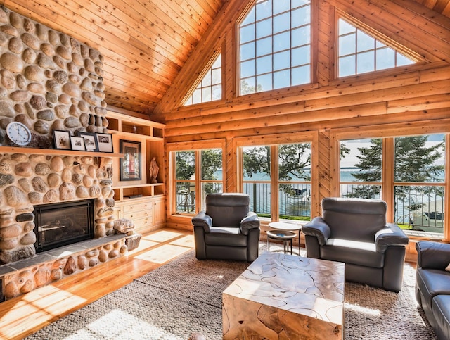 living room with a fireplace, wood finished floors, wood ceiling, and lofted ceiling