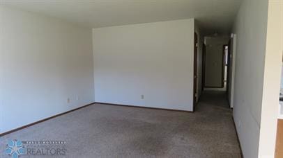 empty room featuring carpet flooring