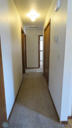 corridor with visible vents and baseboards