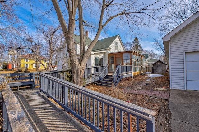 exterior space featuring a residential view and a wooden deck