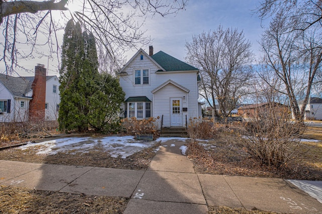 view of front of property featuring a chimney