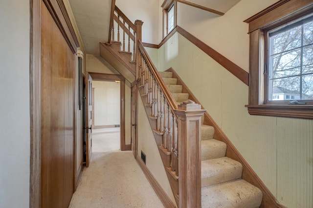 staircase featuring visible vents