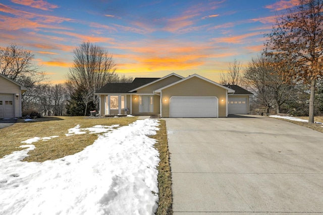 ranch-style house with an attached garage and driveway