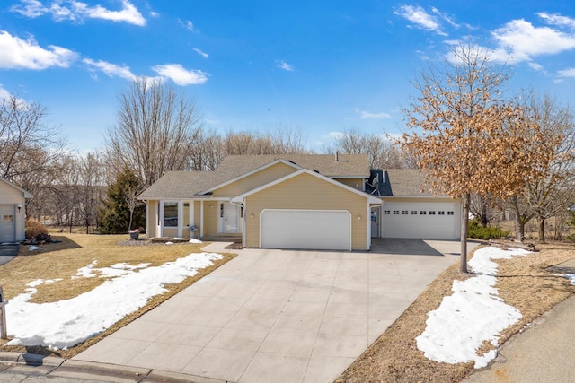 ranch-style home featuring driveway and a garage