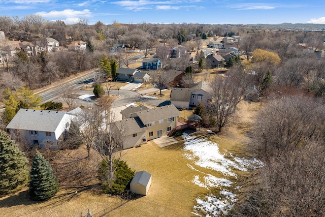 birds eye view of property with a residential view