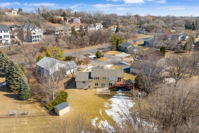 birds eye view of property with a residential view