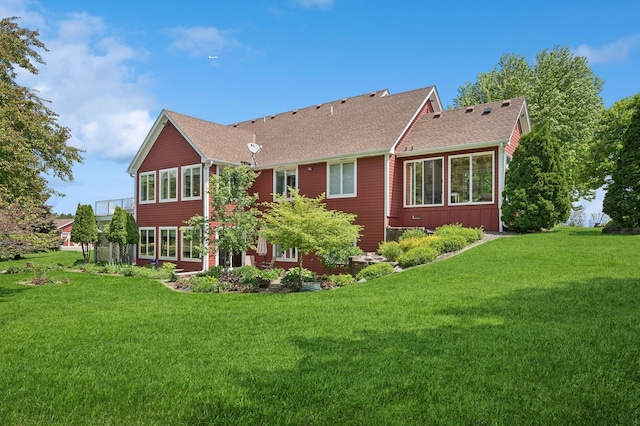 5191 Christen Ave NE, Buffalo, MN 55313 - rear view of property with a lawn and a shingled roof
