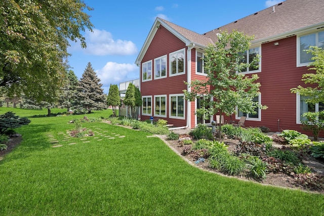 5191 Christen Ave NE, Buffalo, MN 55313 - rear view of house featuring a lawn