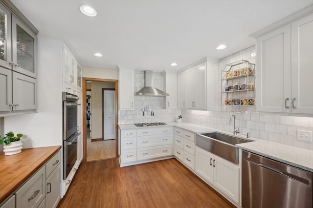 5191 Christen Ave NE, Buffalo, MN 55313 - kitchen featuring dark wood-style floors, a sink, appliances with stainless steel finishes, wall chimney range hood, and butcher block counters
