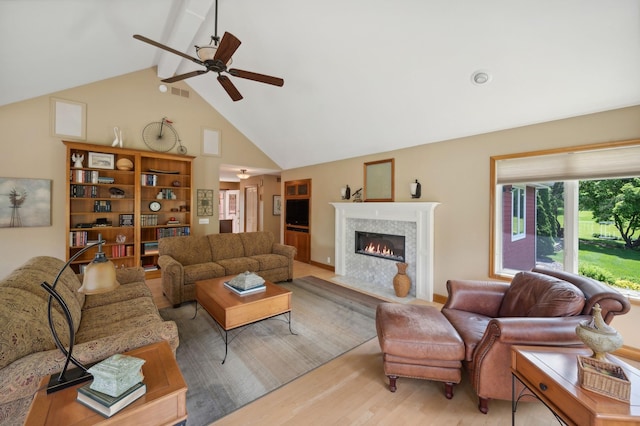 5191 Christen Ave NE, Buffalo, MN 55313 - living room with wood finished floors, visible vents, a fireplace with flush hearth, ceiling fan, and beamed ceiling